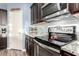Close up of the kitchen featuring stainless steel appliances, tile backsplash, and ample counter space at 30370 N Opal Dr, San Tan Valley, AZ 85143