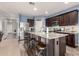 Spacious kitchen featuring stainless steel appliances, a large island, and sleek countertops at 30370 N Opal Dr, San Tan Valley, AZ 85143