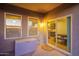 Covered patio with tile flooring, providing access to the interior and outdoor storage, ideal for entertaining at 30370 N Opal Dr, San Tan Valley, AZ 85143