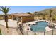 Aerial view of custom home featuring a private pool, slide, and a three-car garage at 3312 N 89Th Pl, Mesa, AZ 85207