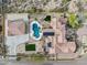 Aerial view of desert home featuring pool, hot tub, patio, tile roof and manicured desert landscaping at 3312 N 89Th Pl, Mesa, AZ 85207