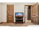 This bedroom features paneled doors and trim and a tv on a stand at 3312 N 89Th Pl, Mesa, AZ 85207