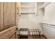 This closet has built in shelves on each side and two folding luggage racks at 3312 N 89Th Pl, Mesa, AZ 85207