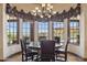 Cozy dining room with large bay window offering picturesque views and natural light at 3312 N 89Th Pl, Mesa, AZ 85207