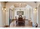 Formal dining room with wood floors, chandelier, and large windows at 3312 N 89Th Pl, Mesa, AZ 85207