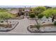 Beautiful desert home with lush landscaping, a circular driveway, and a grand entrance at 3312 N 89Th Pl, Mesa, AZ 85207