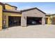 Garage features stone accents, and interior parking for two vehicles at 3312 N 89Th Pl, Mesa, AZ 85207