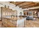 Open-concept kitchen with granite island flows seamlessly into the living area at 3312 N 89Th Pl, Mesa, AZ 85207