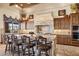Gourmet kitchen featuring a large island with seating and high-end appliances at 3312 N 89Th Pl, Mesa, AZ 85207