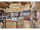 Gourmet kitchen with granite island, stainless appliances and breakfast bar with seating at 3312 N 89Th Pl, Mesa, AZ 85207