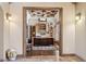 Spacious office with custom built-ins, ceiling detail, and wood floors at 3312 N 89Th Pl, Mesa, AZ 85207