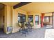 A cozy patio setting featuring a small table and chairs, perfect for intimate outdoor dining at 3312 N 89Th Pl, Mesa, AZ 85207