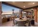 An outdoor dining area offers seating, grilling and views of the yard at 3312 N 89Th Pl, Mesa, AZ 85207