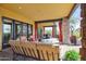 Expansive patio with comfortable seating, outdoor dining area, and views of the surrounding landscape at 3312 N 89Th Pl, Mesa, AZ 85207