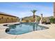Inviting pool featuring a slide, rock features, and a relaxing lounge chair for ultimate outdoor enjoyment at 3312 N 89Th Pl, Mesa, AZ 85207