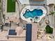 Overhead view of luxury pool with slide, hot tub, and desert landscaping in a serene backyard setting at 3312 N 89Th Pl, Mesa, AZ 85207