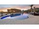 Backyard swimming pool featuring inset lighting and an adjacent water feature at 3312 N 89Th Pl, Mesa, AZ 85207