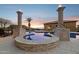 Custom swimming pool features elevated spa, custom columns, and distant mountain views at 3312 N 89Th Pl, Mesa, AZ 85207