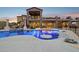 Spacious swimming pool featuring custom lighting, swim up bar, and ample patio space at 3312 N 89Th Pl, Mesa, AZ 85207