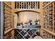 A well-stocked wine cellar featuring custom wood racking for extensive bottle storage at 3312 N 89Th Pl, Mesa, AZ 85207