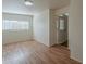 Room with wood floors, a view from the window and a white door at 3327 W Mohawk Ln, Phoenix, AZ 85027
