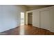 Bedroom with laminate flooring and sliding door closet at 3327 W Mohawk Ln, Phoenix, AZ 85027