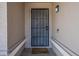Close-up of the home's front door with security screen and covered entryway at 3327 W Mohawk Ln, Phoenix, AZ 85027