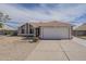 Single-story home featuring a two-car garage, desert landscaping, and covered entry at 3327 W Mohawk Ln, Phoenix, AZ 85027
