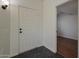 Bright foyer featuring tile flooring and a white door, with views to another room at 3327 W Mohawk Ln, Phoenix, AZ 85027