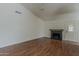 Living room featuring hard wood floors, a fireplace and door to the backyard at 3327 W Mohawk Ln, Phoenix, AZ 85027
