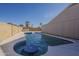 Backyard pool, with blue tiled trim, also features a built in table and seating area at 3327 W Mohawk Ln, Phoenix, AZ 85027