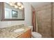 Bathroom with granite countertop vanity and tile shower at 352 E Beatryce St, Tempe, AZ 85288