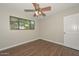 Bright bedroom features wood floor and natural light at 352 E Beatryce St, Tempe, AZ 85288