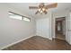 Bedroom with wood flooring, ceiling fan, and closet at 352 E Beatryce St, Tempe, AZ 85288