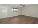 Bright living room featuring laminate flooring and a large front window at 352 E Beatryce St, Tempe, AZ 85288