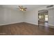 Open concept living room with laminate flooring and view to back patio and pool at 352 E Beatryce St, Tempe, AZ 85288
