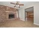 Living room with brick fireplace and tile floor at 352 E Beatryce St, Tempe, AZ 85288