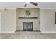 Beautiful fireplace with a decorative stone surround as a focal point at 3907 W Sharon Ave, Phoenix, AZ 85029
