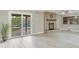 Bright living room features a fireplace and sliding doors to the backyard at 3907 W Sharon Ave, Phoenix, AZ 85029