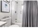 Clean bathroom featuring white subway tile shower with grey fixtures, and modern hardware at 5422 E Des Moines St, Mesa, AZ 85205
