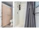 This bathroom has tile floors, a shower stall, a toilet, and built-in shelving at 5422 E Des Moines St, Mesa, AZ 85205