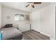 This bedroom features a twin bed, wood floors, six-drawer dresser, and a closet at 5422 E Des Moines St, Mesa, AZ 85205