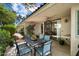 Outdoor patio showcasing dining table, chairs, ceiling fan, and lush plants at 5465 N 78Th St, Scottsdale, AZ 85250