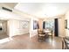 Dining area featuring a round wood table, decorative lighting, and plank flooring at 5465 N 78Th St, Scottsdale, AZ 85250