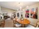 Bright dining room with modern chandelier and seamless flow into the living room at 5465 N 78Th St, Scottsdale, AZ 85250