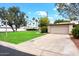 Home with well-manicured lawn, mature trees, a two-car garage, and neutral paint at 5465 N 78Th St, Scottsdale, AZ 85250