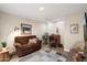 Comfortable living room with a brown sofa and decorative accents at 5465 N 78Th St, Scottsdale, AZ 85250