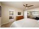 Bright bedroom with ensuite bathroom, featuring ceiling fan and ample closet space at 5465 N 78Th St, Scottsdale, AZ 85250