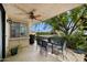 Charming covered patio features a ceiling fan and a dining area with seating for six at 5465 N 78Th St, Scottsdale, AZ 85250
