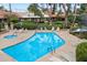 Community pool area with a hot tub, lounge chairs, and shade umbrellas at 5465 N 78Th St, Scottsdale, AZ 85250